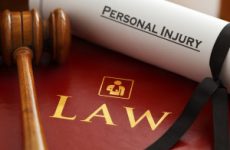 Inspector. Graphic logo is my artwork. Thanks.  Red leather Personal Injury Law book and gavel with gold embossed type and stylised icon of figure with arm in a sling embossed on the book cover and a Personal Injury writ.